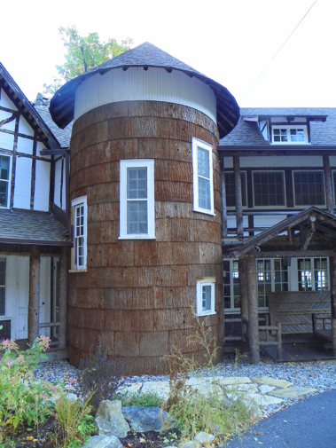 Custom rustic bark siding by Adirondack LogWorks