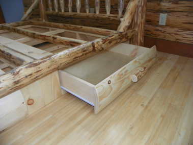 Custom rustic log bed with drawers and log trim by Adirondack LogWorks