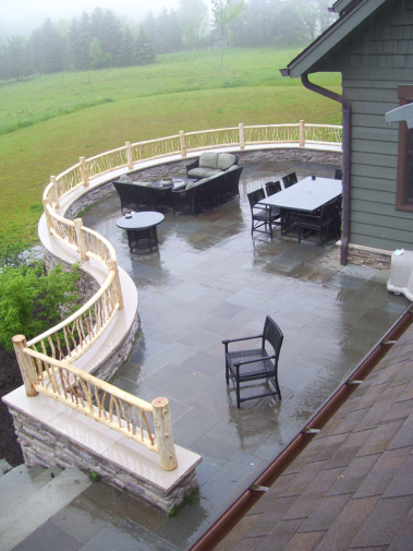 Custom rustic log posts and vertical twig railings by Adirondack LogWorks