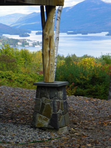 Custom rustic log support posts by Adirondack LogWorks