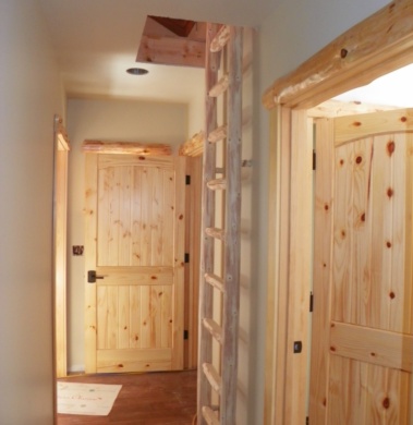 Custom rustic log trim woodwork and log ladder by Adirondack LogWorks