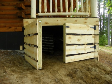 Custom rustic log siding and log gate by Adirondack LogWorks