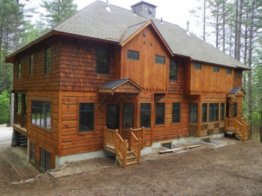 Custom log home entryway truss woodwork at Ski Bowl Village in North Creek, N.Y., by Adirondack LogWorks