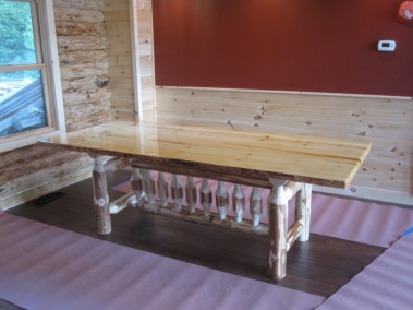 Custom rustic log dining room table with live-edge slab top by Adirondack LogWorks