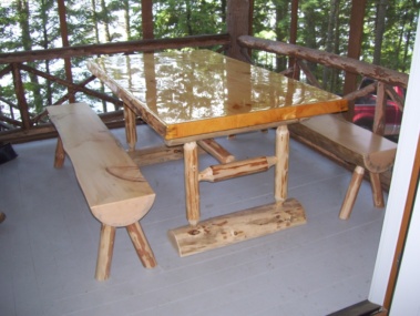 Custom rustic log picnic table by Adirondack LogWorks