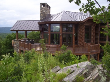 Custom rustic log railing and post woodwork by Adirondack LogWorks
