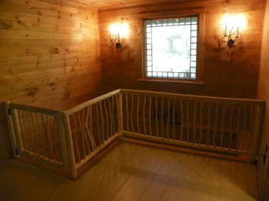 Custom-made vertical twig log railings by Adirondack LogWorks