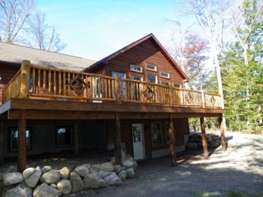 Custom rustic log railings with diamond twig woodwork by Adirondack LogWorks