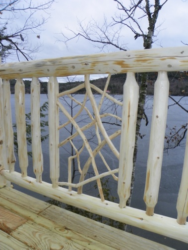 Custom rustic log railing with twig woodwork by Adirondack LogWorks