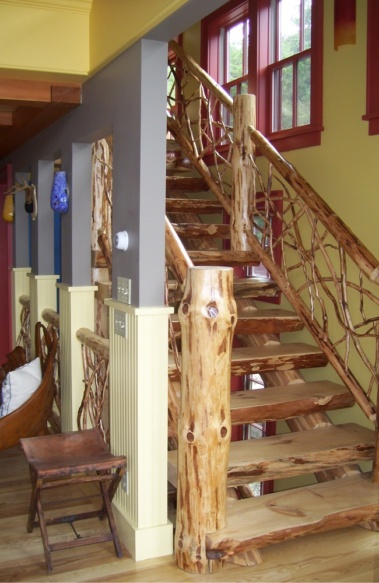 Custom rustic twig railing and log stair woodwork by Adirondack LogWorks