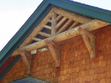 Custom rustic bark-on log trussing by Adirondack LogWorks