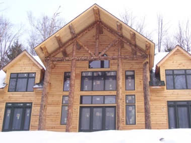 Custom rustic log home truss woodwork by Adirondack LogWorks