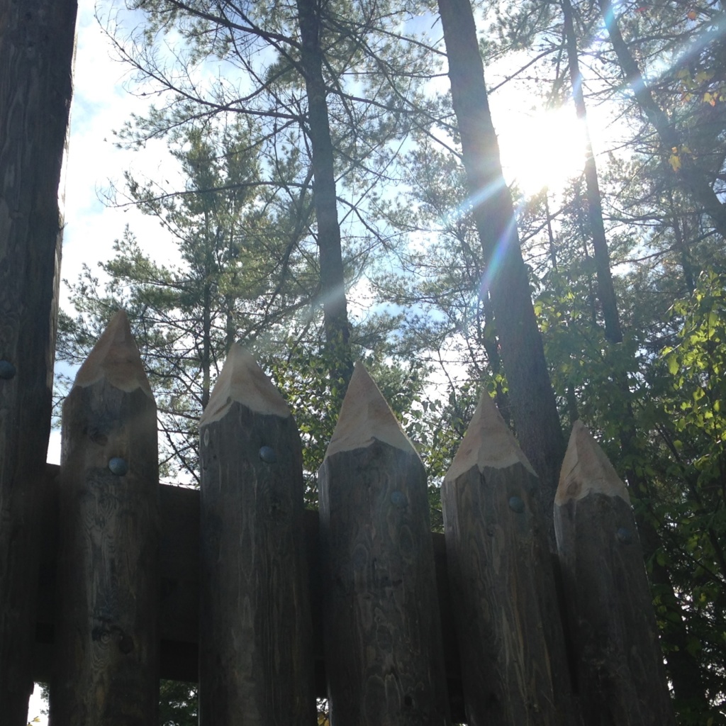 Custom rustic log stockade gate and woodwork for Gateway to the Adirondacks Frontier Town Campground project by Adirondack LogWorks