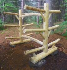 Custom rustic log kayak rack by Adirondack LogWorks