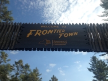 Custom rustic log stockade gate and woodwork for Gateway to the Adirondacks Frontier Town Campground project by Adirondack LogWorks