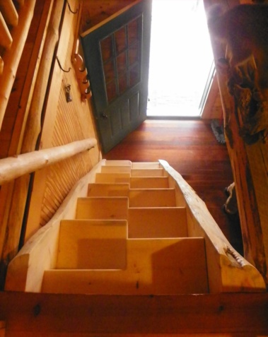 Custom rustic log paddle stairs by Adirondack LogWorks