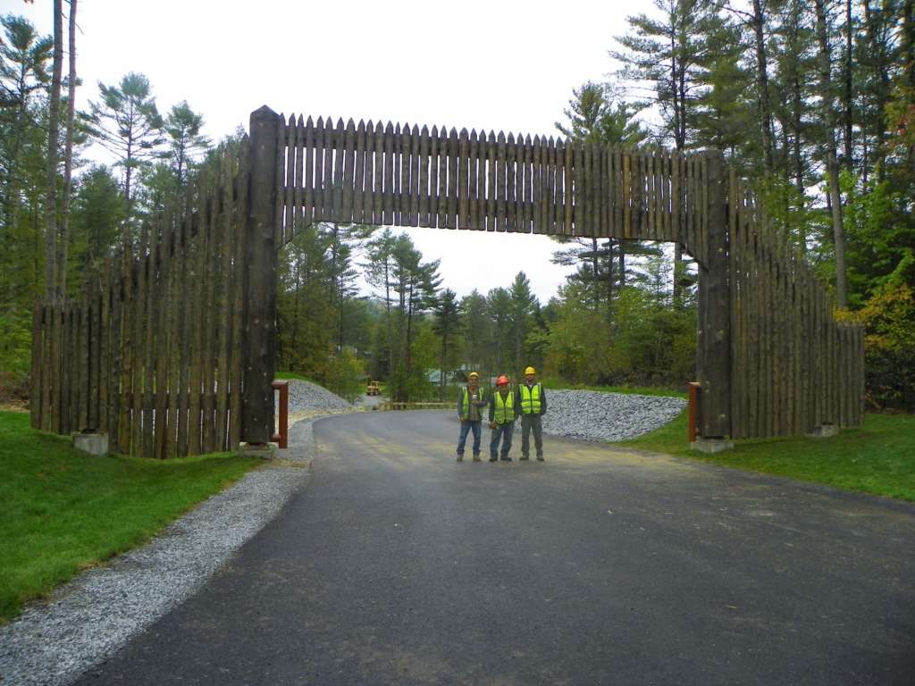 Custom rustic log stockade gate and woodwork for Gateway to the Adirondacks Frontier Town Campground project by Adirondack LogWorks