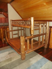 Custom rustic twig and log bunk bed by Adirondack LogWorks