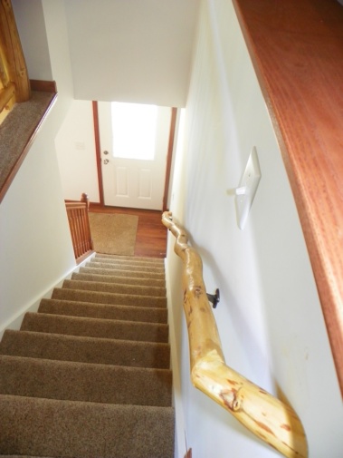 Custom rustic log handrail by Adirondack LogWorks